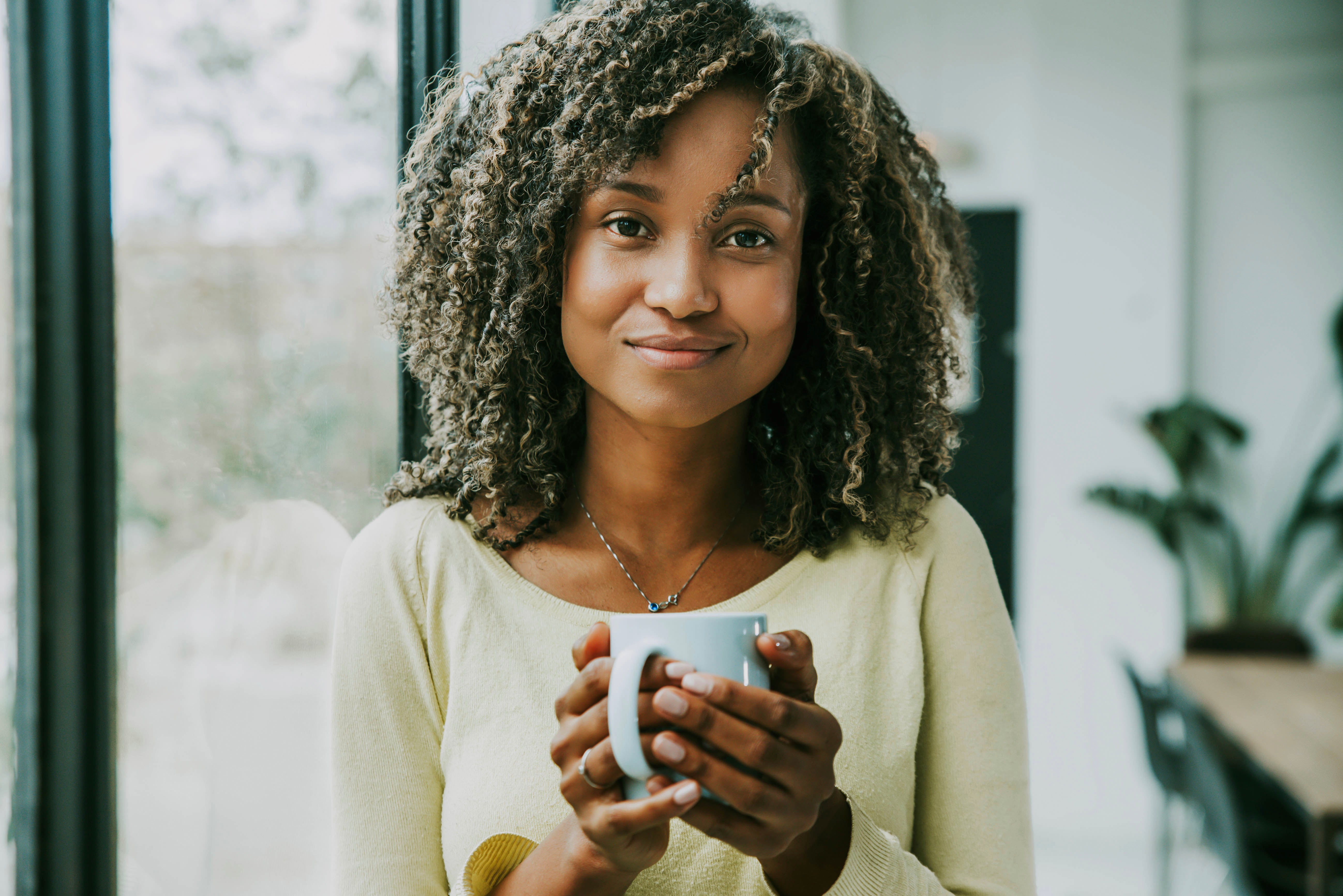 files/portrait-of-young-black-woman-holding-cup-of-tea-l-2022-12-17-03-38-36-utc.jpg